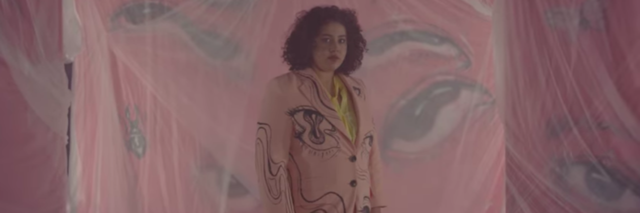 Singer Odette's New Album Is All About Her Experience With BPD Singer Odette wearing a pink outfit