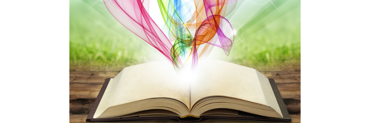 Why I Write Poetry About My Trauma Recovery A book opened up with colors coming out