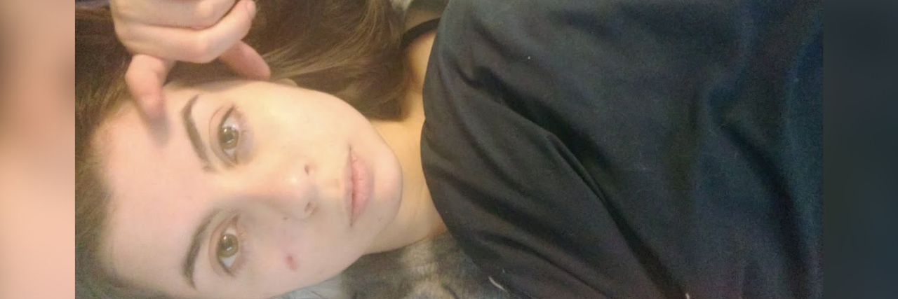 Makeup and Your Mental Health Photo of the contributor, a white woman, looking up at the camera