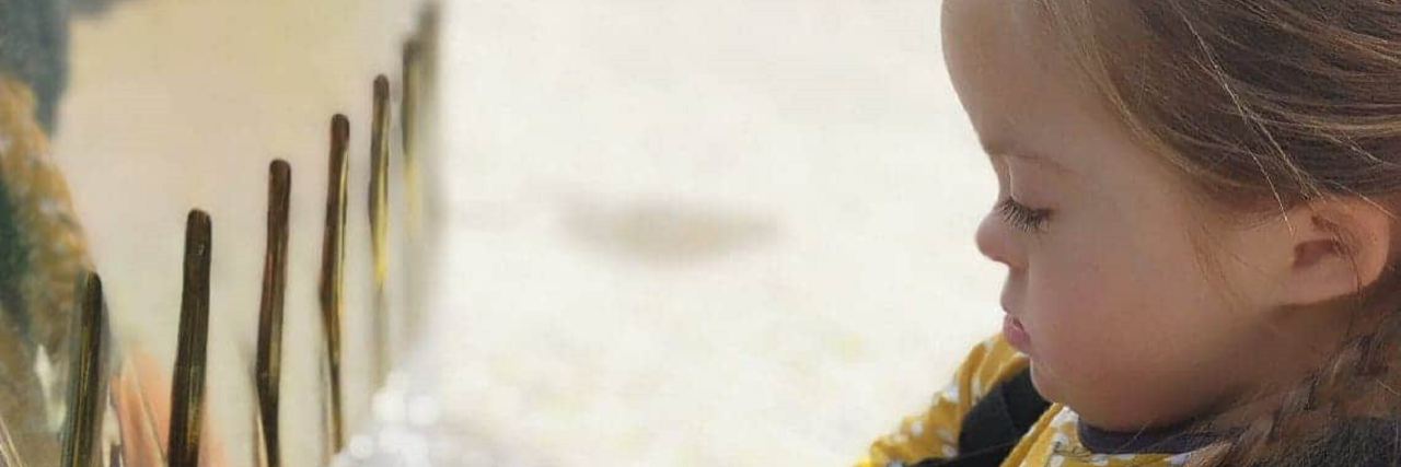 Why EHCP Assessments Should Be Mandatory for Kids With Down Syndrome Betsy playing in a fountain.