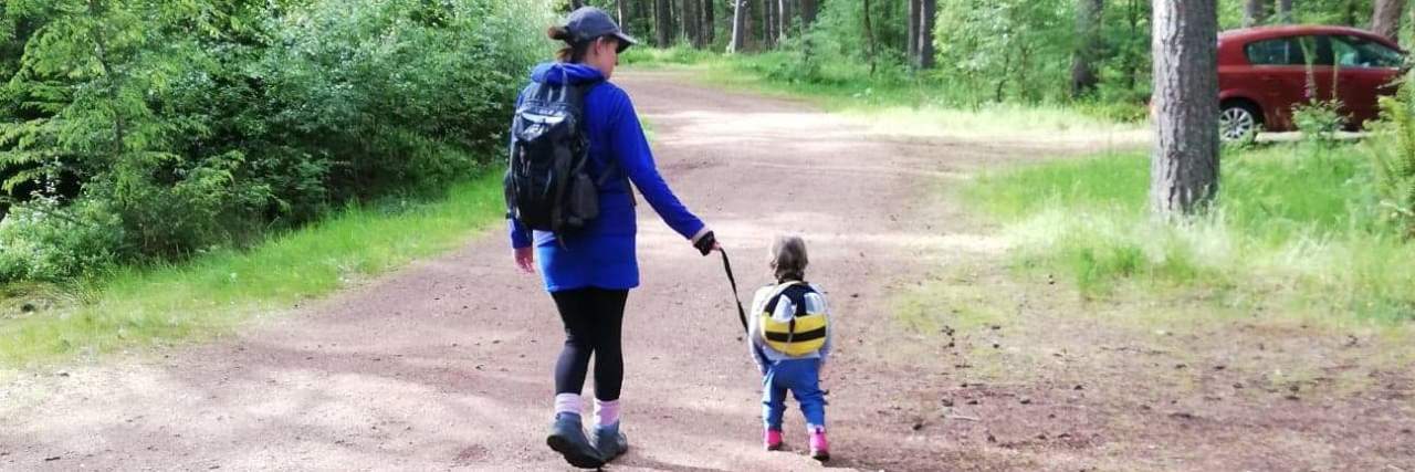 Rachel walking with her daughter.
