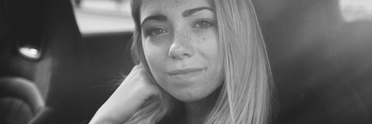 OCD Recovery: What to Know If Family Doesn't Understand Your Progress black and white photo of woman looking into camera from inside a car