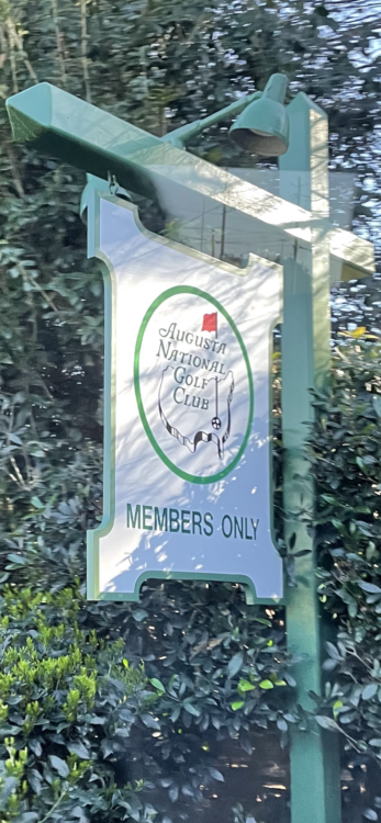 August National Golf Course sign, green hanging near trees