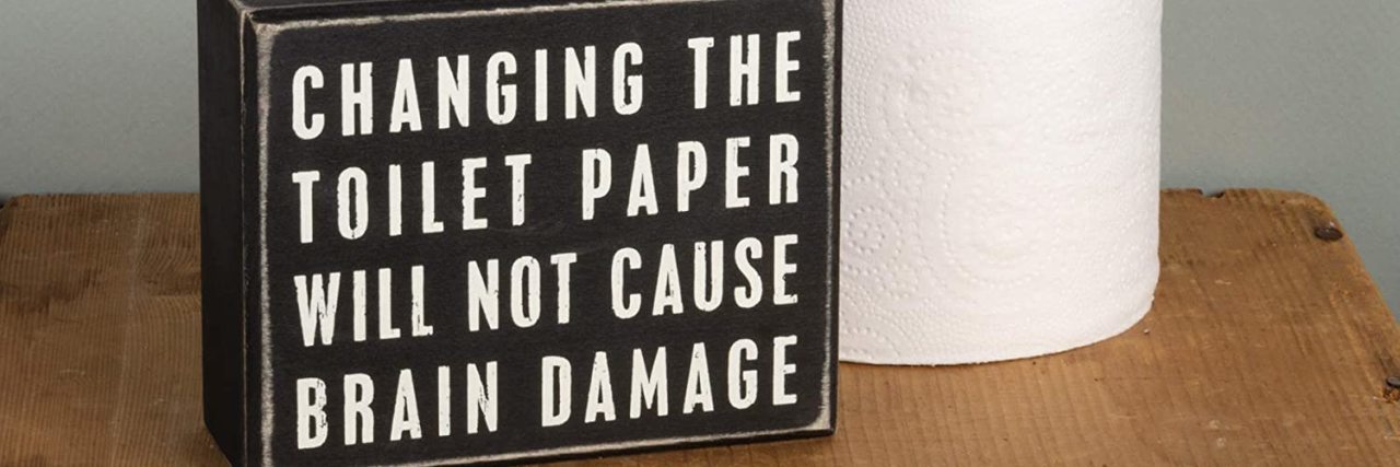 Why Jokes About Brain Damage Aren't Funny to Many With Cerebral Palsy Sign that reads "Changing the toilet paper will not cause brain damage."