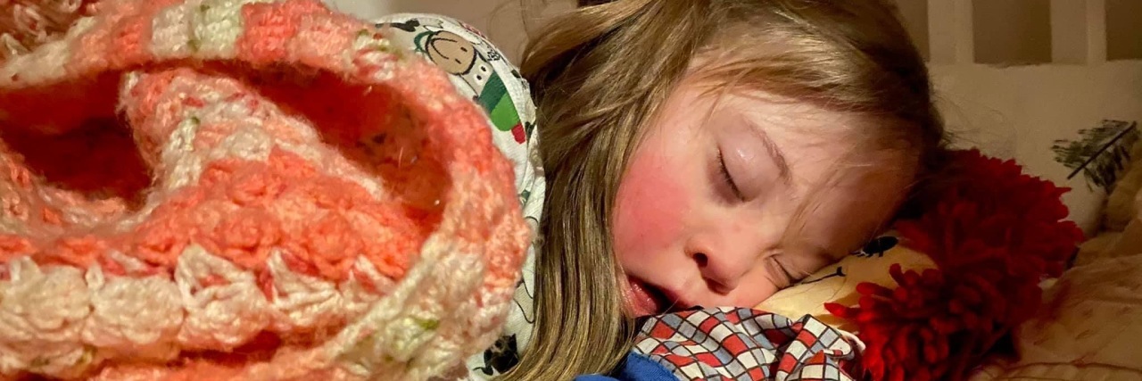 Dear World, Please Be Kind to My Daughter With Down Syndrome Kristin's daughter Lily napping.