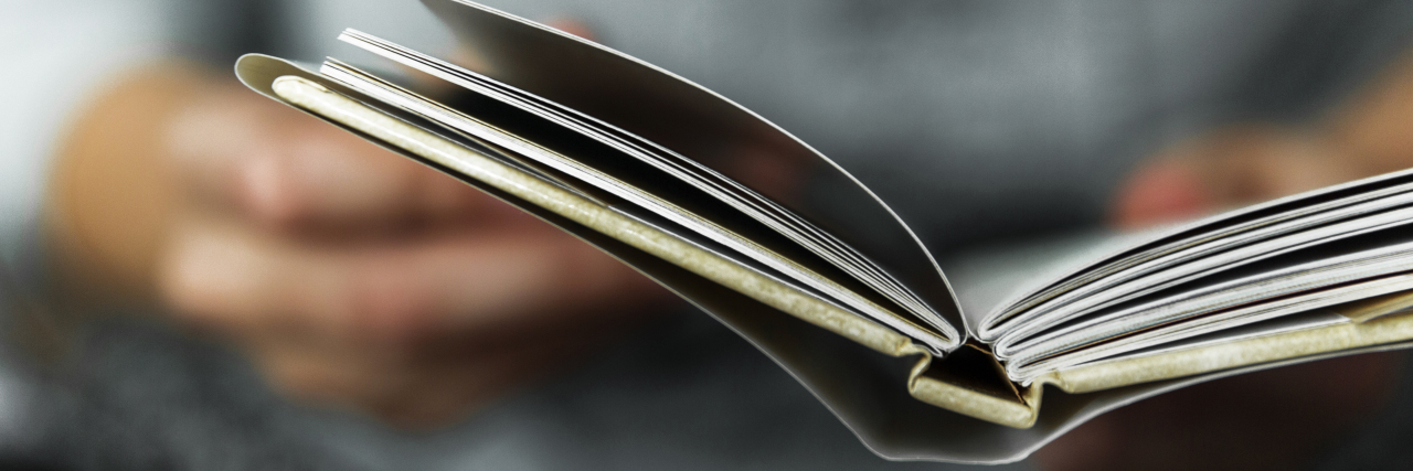 How the Book 'Bravey' Changed My View of Depression hands flipping through a book