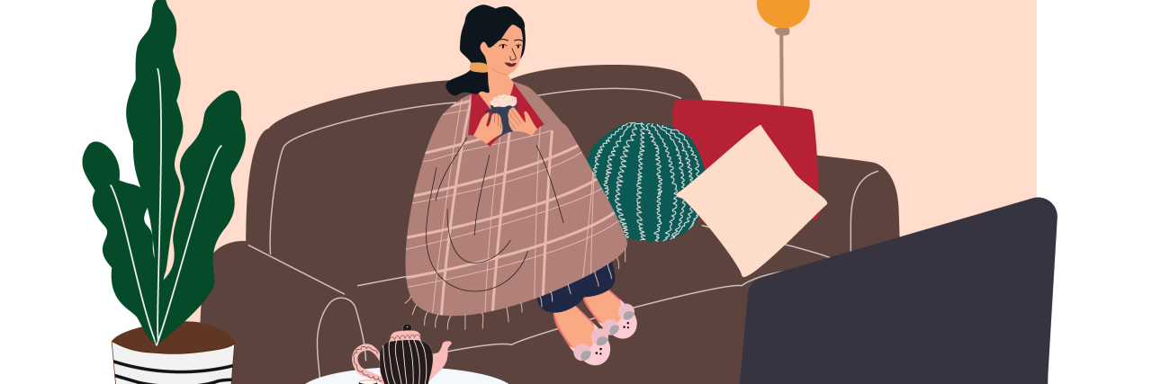Why Watching Triggering Material as a Trauma Survivor Is Good for Me illustration of a woman sitting on a touch wrapped in a blanket and watching tv