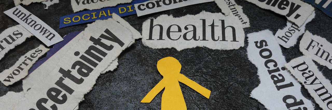 Paper man cutout surrounded by Corona Virus and economic news headlines