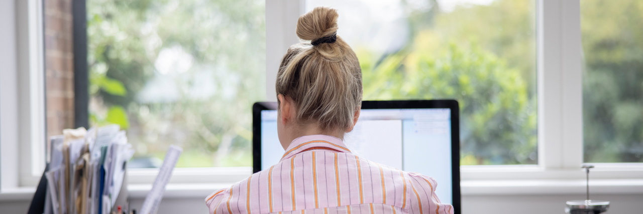 Navigating Friendships and Business With a Craniofacial Disability Woman Working From Home On Computer