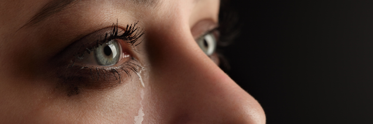 When Healing Is Halted Because of Complicated Grief a tear rolling down a woman's cheek