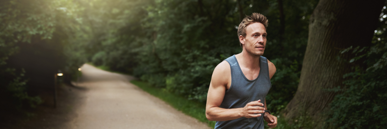 Coping With COVID-19 Pandemic Stress When You're Autistic Man jogging.