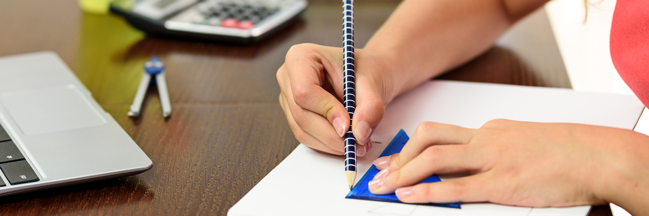 My Difficultly With Math Isn't Because I'm a Woman a woman's hand doing geometry homework