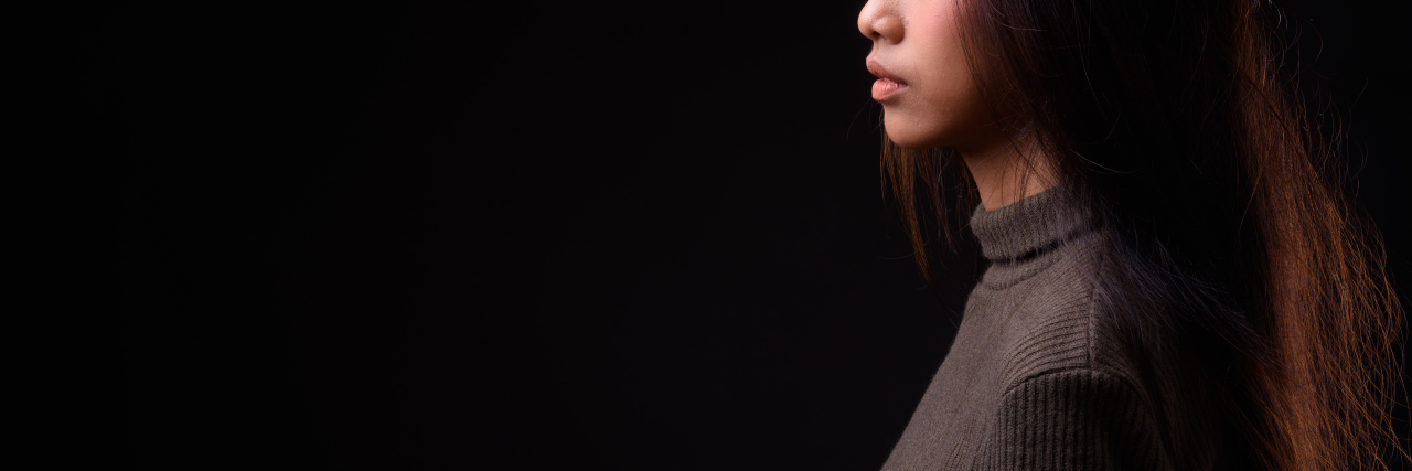 How the Hyper-Sexualization of Asian Women Can Be Deadly Asian woman against a Black background