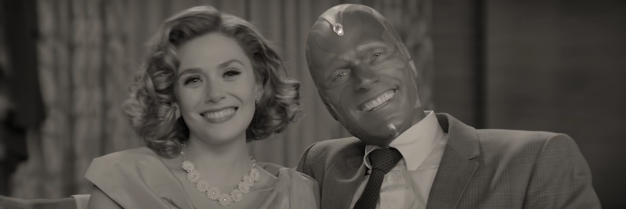 Watching Wandavision and Catharsis as a Grief and Trauma Survivor screenshot from Disney and Marvel's WandaVision, showing Wanda and Vision posing and smiling for the camera in 1950s sitcom style