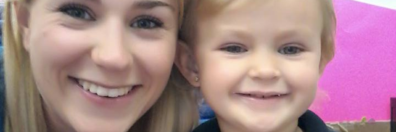 photo of the contributor, a mother with her young daughter. they both have blonde hair and are smiling for the camera