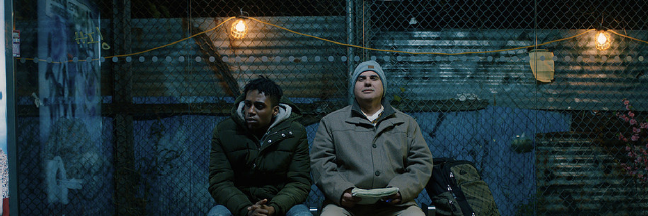 First Film With DeafBlind Actor in Lead Role Nominated for Oscar Two men sitting next to each other on a bench