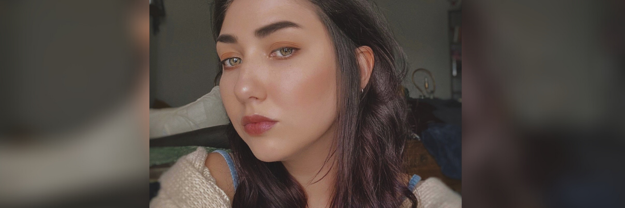 How to Start the Conversation If You Think a Loved One is Self-Harming photo of the contributor looking into the camera with a serious expression