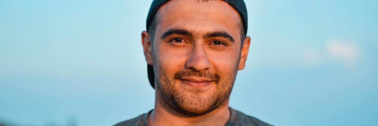 A Discussion on Self-Awareness and Schizophrenia A man with a backwards hat on, looking forward