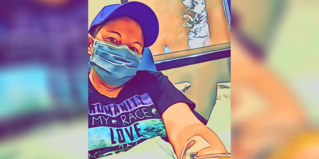 Katy wearing a mask at the hospital getting an infusion.