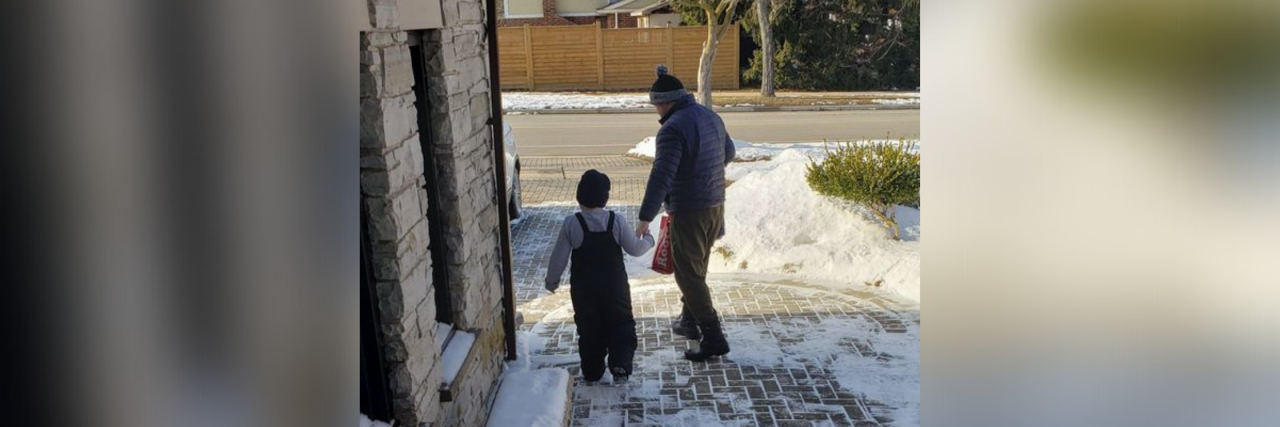 Max's dad walks him to school.