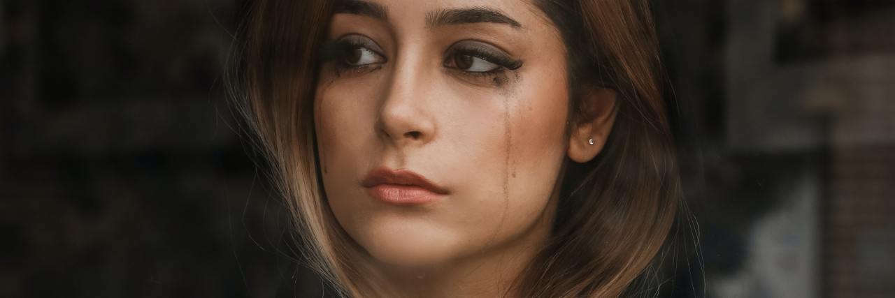 When a Doctor Asked if I Wanted To Sleep and Not Wake Up photo of woman looking sad, looking through a window