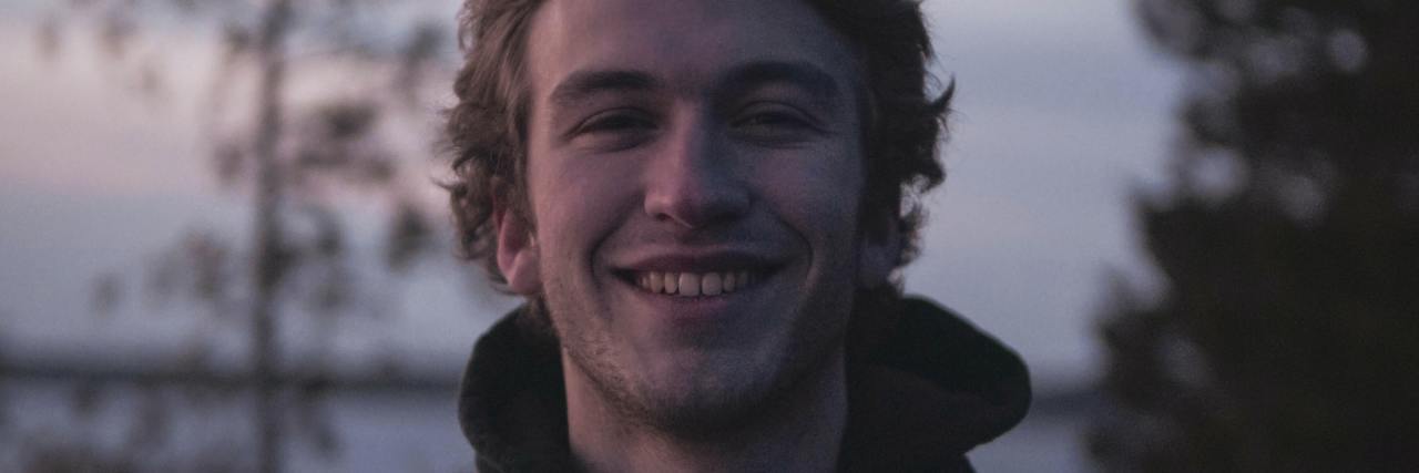 When a Nurse Described Mental Health Patients Like Any Other Patient photo of a man at sunset smiling for the camera