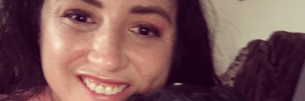 Fighting for a Label for Social Security Disability Insurance (SSDI) Contributor smiling with her dog