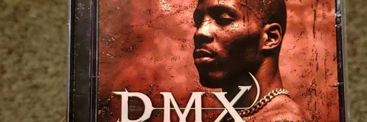 What to Know If You're Triggered by the Death of DMX DMX holding his album "It's Dark and Hell Is Hot"