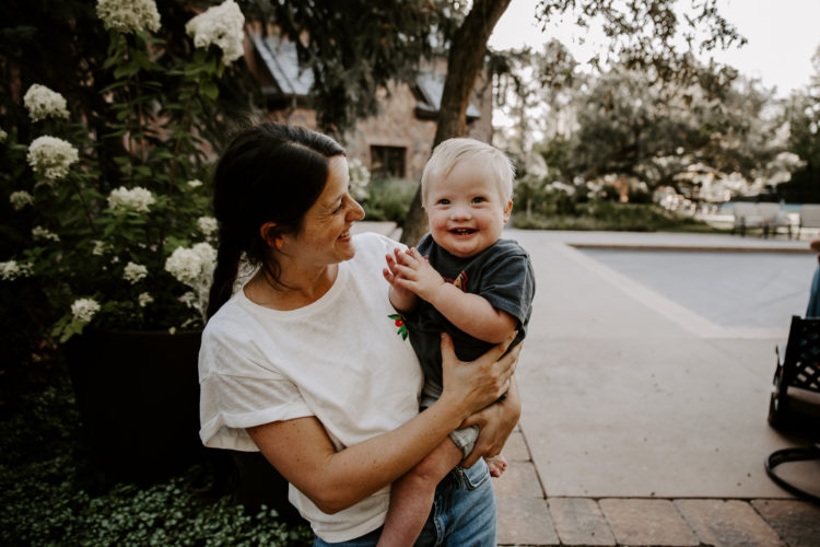 Madison holding her son.