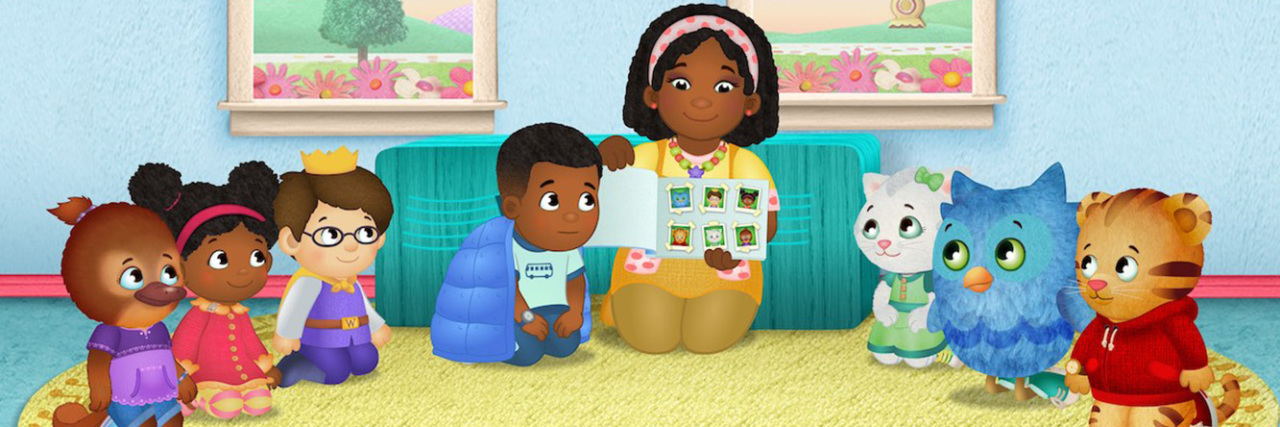 'Daniel Tiger’s Neighborhood' to Feature New Character With Autism A scene from Daniel Tiger's Neighborhood with Max and all of the o there characters on a rug listening to a story.
