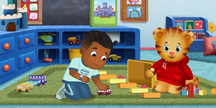 A scene from Daniel Tiger's Neighborhood with Max playing with toy cars