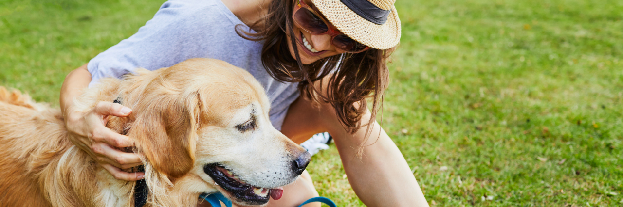 Getting a Nonverbal Learning Disability Diagnosis as an Adult Woman playing with dog outside.