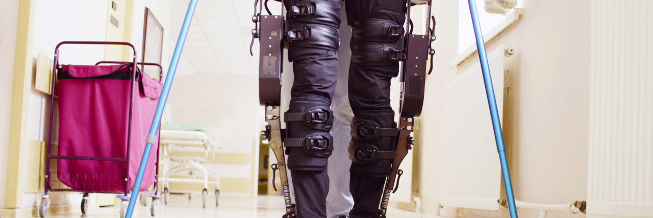 Why We Need to Expand Access to Exoskeleton Technology Man using exoskeleton in rehabilitation clinic.