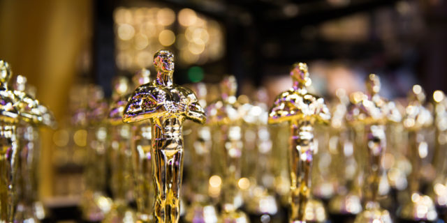 Oscar awards on a table.