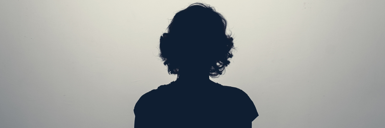 11 Painful Symptoms I Experience With Functional Neurological Disorder Silhouette of the back of a female
