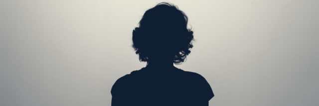 Silhouette of the back of a female