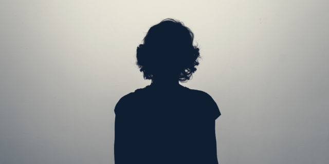Silhouette of the back of a female