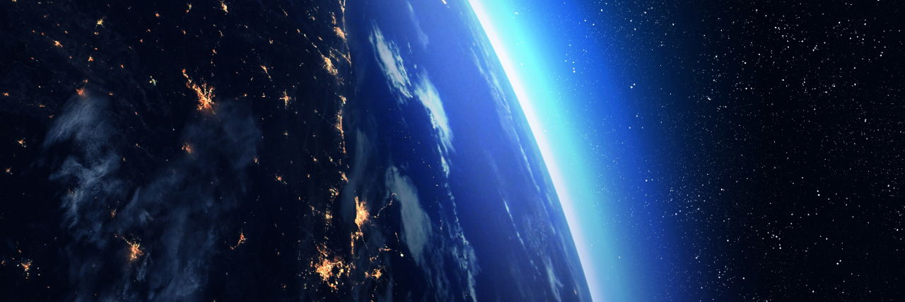 Finding My Place in the World as a Person Who Stutters The Earth at night viewed from space with city lights.