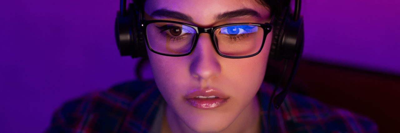 Self-Care Tips For Anyone Triggered By This Disturbing TikTok Trend woman looking at computer