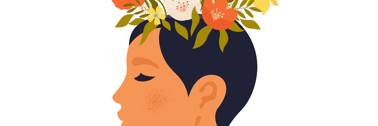 Illustration of woman's profile, with flowers on top of her head