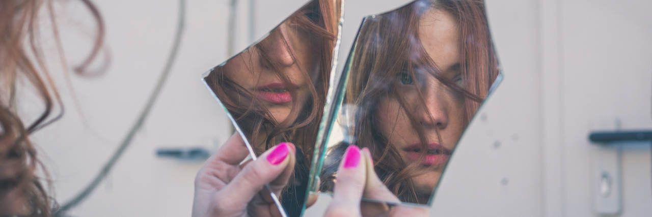 What Depression Is Like: the Gremlins in My Head girl with long hair and blue eyes looking at herself in a broken mirror