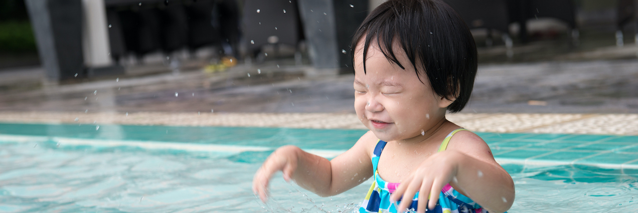 Taking Things Slowly After Experiencing Relational Trauma AAPI toddler in shallow end of pool