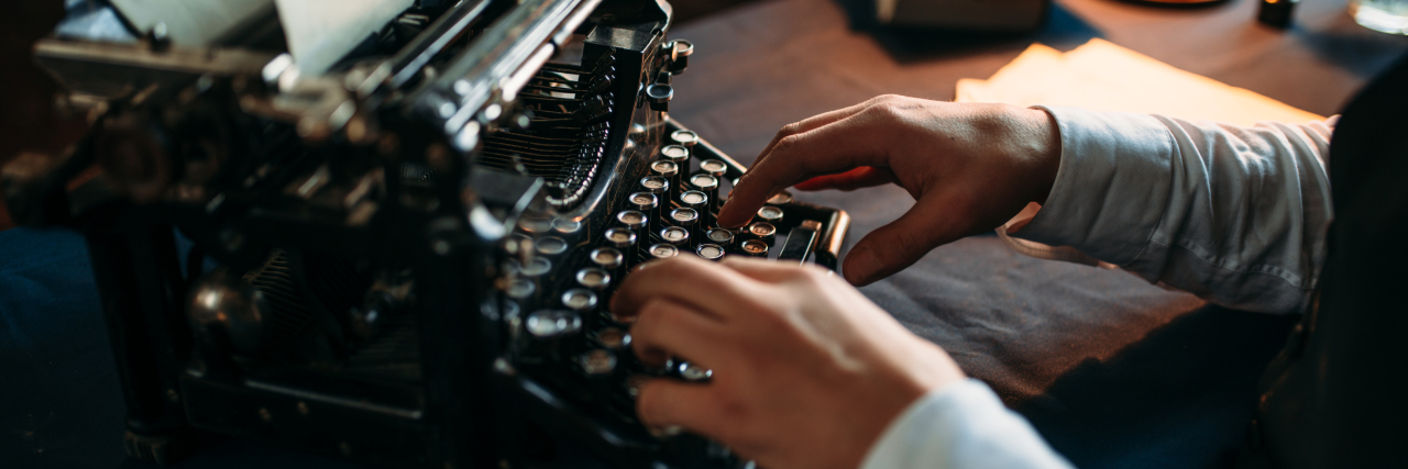 The Importance of Telling the Stories of Our Autistic Lives Man using old-fashioned typewriter.