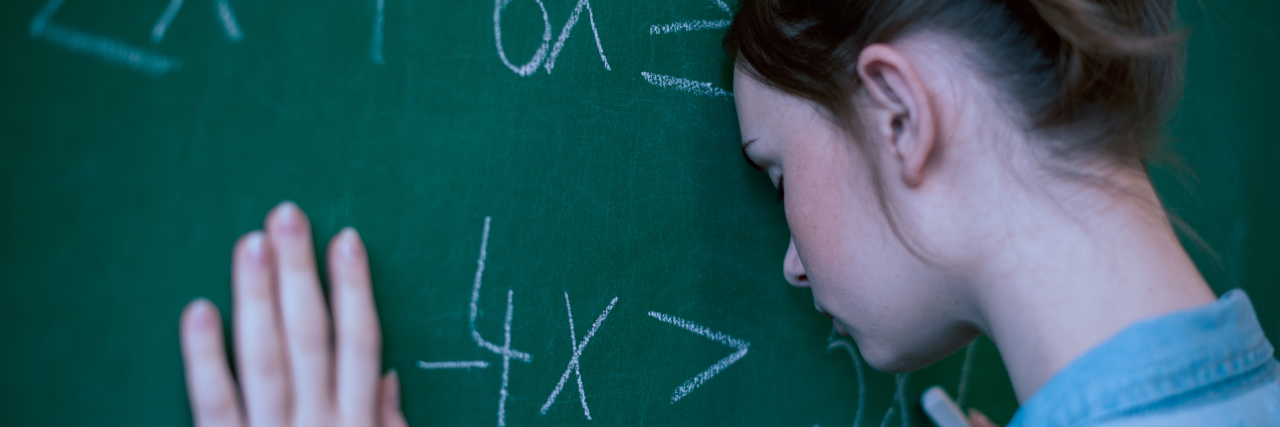 Girl struggling in math class.