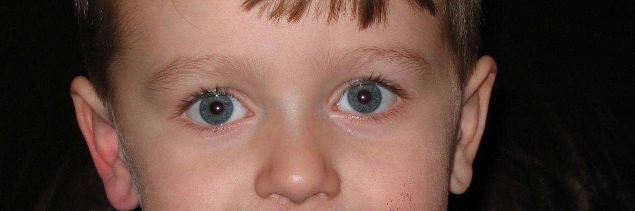 Why You Shouldn't Pressure Your Autistic Child to Make Eye Contact Kathy's son Ryan as a small child with chocolate on his face.