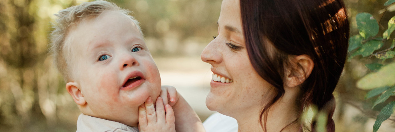 Why School Inclusion Could Help End Ignorance About Down Syndrome Madison holding her son who has Down syndrome.