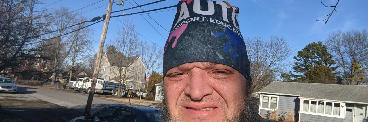 What It's Like Having Hyperempathy as an Autistic Person Matt wearing his autism beanie hat.