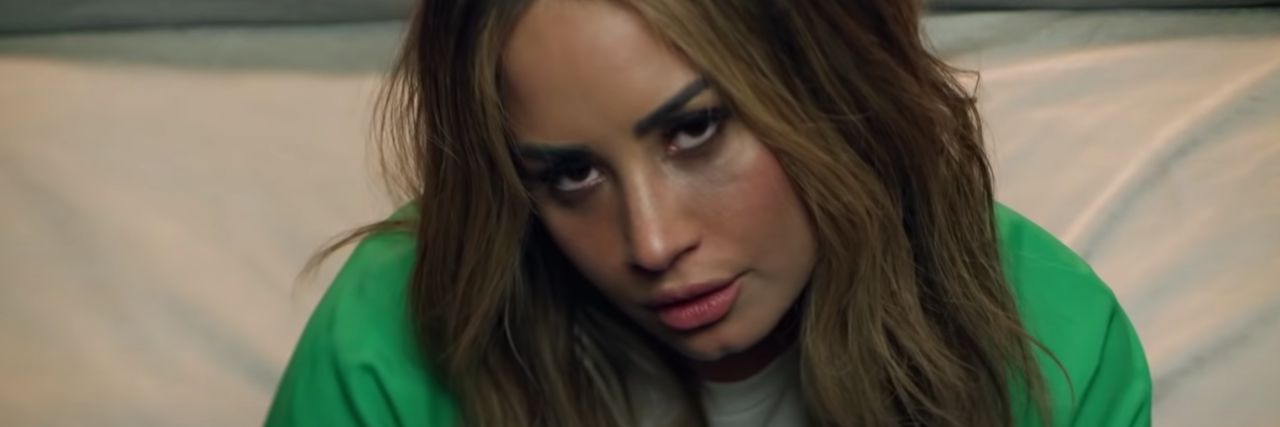 Demi Lovato's Song 'Dancing With The Devil' Perfectly Shows Addiction Demo Lovato from her music video "Dancing With the Devil"