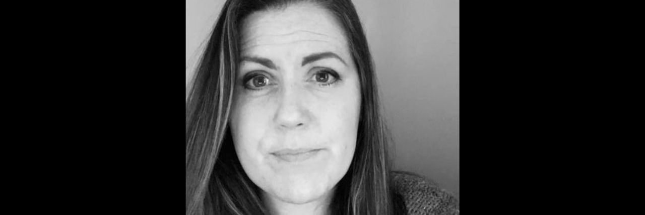 To the Mama Who Didn't Get to Have a 'Normal' Childhood a black and white photo of a young woman with long hair