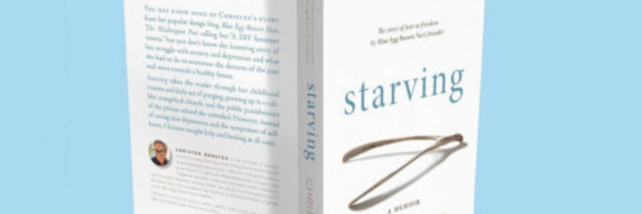 How Writing a Memoir About My Trauma Helped Heal and Free Me Photo of the author's memoir, "Starving" standing up on a blue background